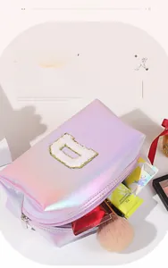 Iridescent pink makeup bag with gold-bordered chenille letter D and large capacity