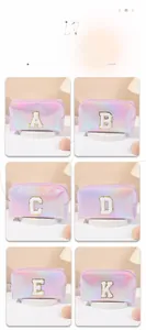 Detail of holographic laser makeup bags with colorful letter embroidery and smooth zippers