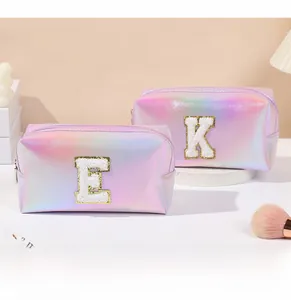 Detail showing high-quality towel embroidery letters on holographic PU makeup bags set
