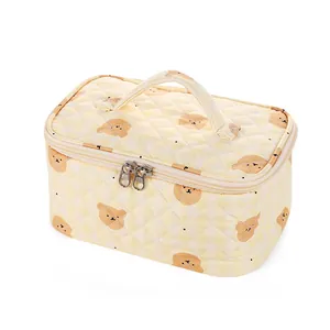 Quilted yellow makeup bag with cartoon bear print and convenient top handle