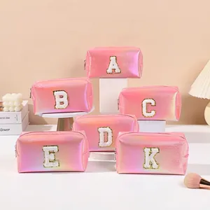 Holographic pink PU makeup bag with glitter letter patches and gold zipper closure