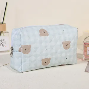 Quilted light blue checkered bear makeup bag with zipper closure for storage