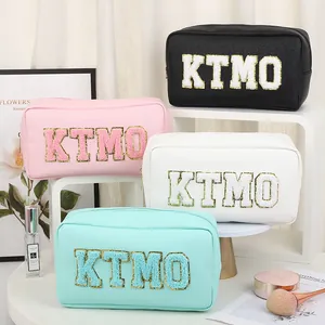 Set of four colorful PU leather cosmetic bags with chenille KTMO letter embroidery