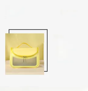 Detail of yellow washbag with metal dual zippers and transparent window panel