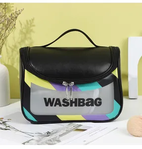 Detail of portable black leather washbag with transparent window and colorful stripes