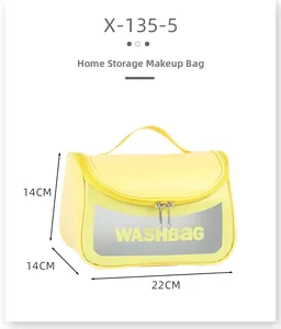 Detail view of yellow waterproof wash bag showing dimensions 22x14x14cm and top handle