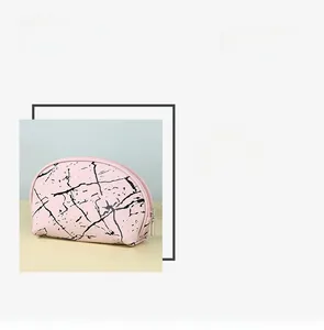Detailed view of large pink marble makeup bag with smooth metal zipper closure