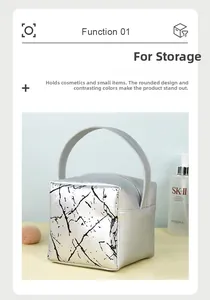 Silver leather makeup bag with black marble pattern and sturdy top handle