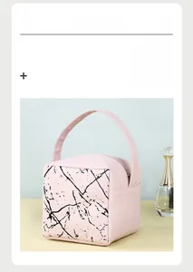 Detail view of pink marble pattern cosmetic bag with handle and zipper closure