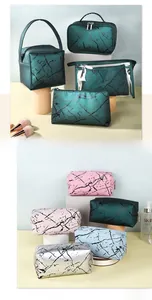 Detail showing various stylish makeup bags in multiple colors with marble patterns