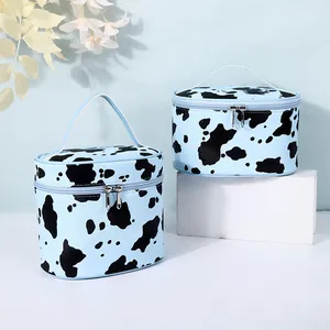 Blue cow print cosmetic bag with large capacity and portable top handle for travel
