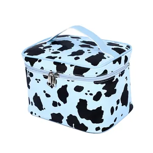 Blue cow print makeup bag with large capacity, sturdy handle and metal zippers