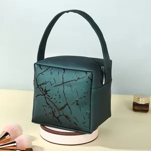 Deep green marble pattern cosmetic bag with top handle and secure zipper closure