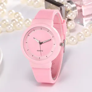 Pink minimalist quartz watch with silicone strap and matching dial for women