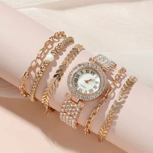 Luxury rose gold women's watch set with rhinestone bezel and four matching bracelets