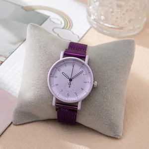 Detail of purple quartz watch with magnetic mesh strap and heart-shaped second hand