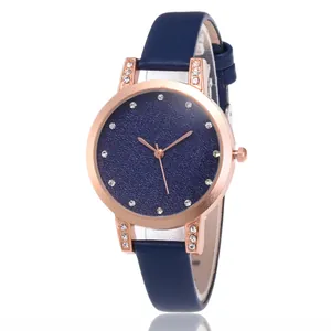 Montre à quartz pour femme avec cadran ciel étoilé, bracelet en cuir bleu et strass