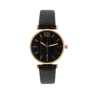 Detail of rose gold case with black textured dial and carbon fiber style watch strap