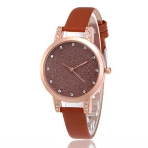 Montre à quartz élégante pour femme avec boîtier or rose, cadran pailleté brun et cuir