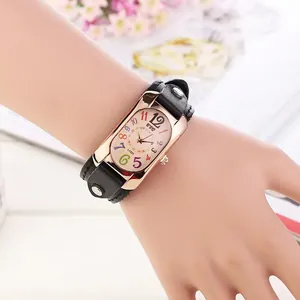 Detail of rectangular rose gold watch with black leather strap and colorful numbers