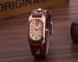 Detail of vintage watch with brown leather rivet strap and colorful numeral dial