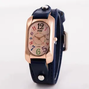 Vintage women's watch with rose gold rectangular case and colorful numerals on blue leather strap
