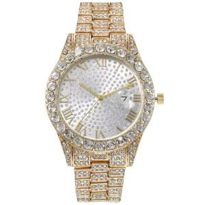 Macro detail of gold rhinestone watch dial with Roman numerals and date window