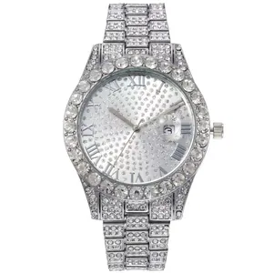 Close-up of a silver iced-out watch with crystal-encrusted dial and Roman numerals