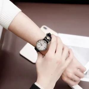 Retro quartz watch for women with white dial, black Arabic numerals and leather strap