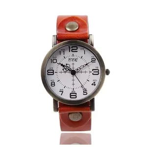 Vintage quartz watch with brown leather strap and retro bronze metal case on white background