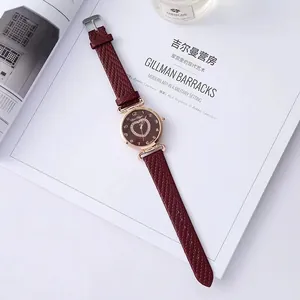 Elegant wine red leather watch with golden case and heart-shaped diamond dial pattern