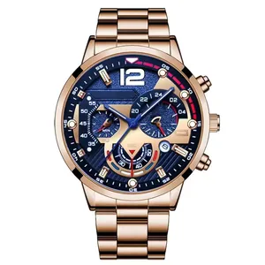 Detail of rose gold men's watch showing navy textured dial with three chronograph sub-dials
