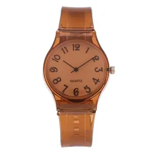Detail view of transparent brown silicone watch with clear numeric dial and quartz movement