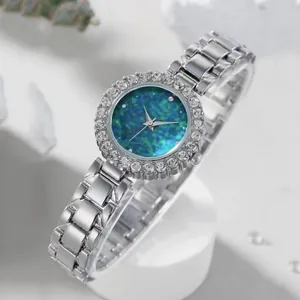 Montre à quartz pour femme avec cadran turquoise étoilé et lunette en strass argent