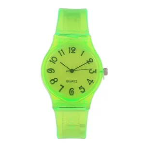 Macro shot of transparent fluorescent green quartz watch with digital scale and silicone strap