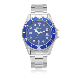 Macro detail of men's quartz diving watch with blue dial and date window display