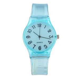 Close-up of light blue jelly watch with transparent silicone strap and quartz dial detail