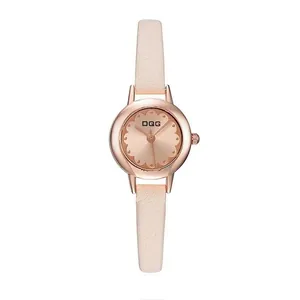 Detailed macro of rose gold floral bezel watch with beige leather strap and sunray dial