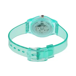 Macro view of transparent mint green silicone watch showing inner silver metal movement