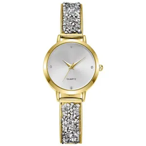 Women's gold quartz watch with a sunray silver dial and sparkling crystal-set bracelet