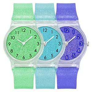 Three colorful glitter silicone watches in green, blue, and purple with Arabic numerals
