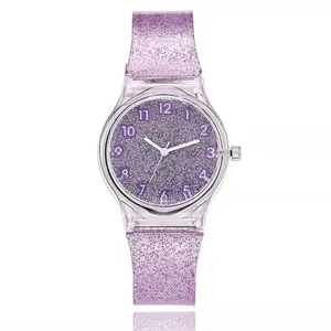 Close-up of purple glitter silicone watch with transparent case and white Arabic numerals