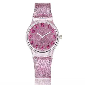 Macro detail of the sparkling pink glitter dial and transparent resin watch strap