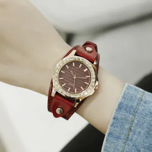 Women's vintage quartz watch with a red leather strap and sparkling crystal bezel
