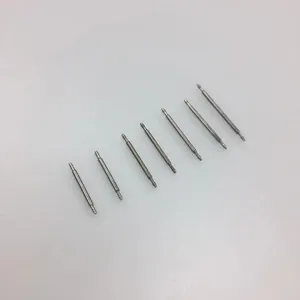 Set of seven stainless steel watch band spring bars in silver metal finish on white background