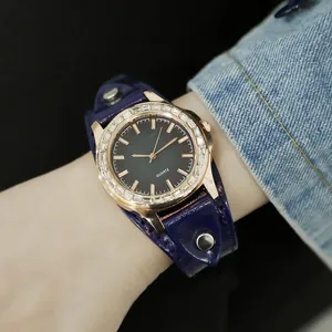 Women's quartz watch with rose gold rhinestone bezel and blue leather bund strap