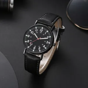 Detail of military style quartz watch with black leather strap and 24-hour dual scale dial