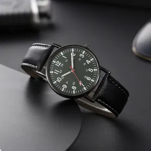 Macro detail of military men's watch with green dial and black leather strap stitching