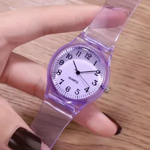 Close-up of translucent purple jelly watch featuring a white dial with Arabic numerals