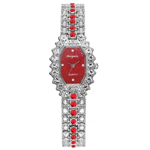 Luxury women's quartz watch with red glitter octagonal dial and rhinestone bracelet